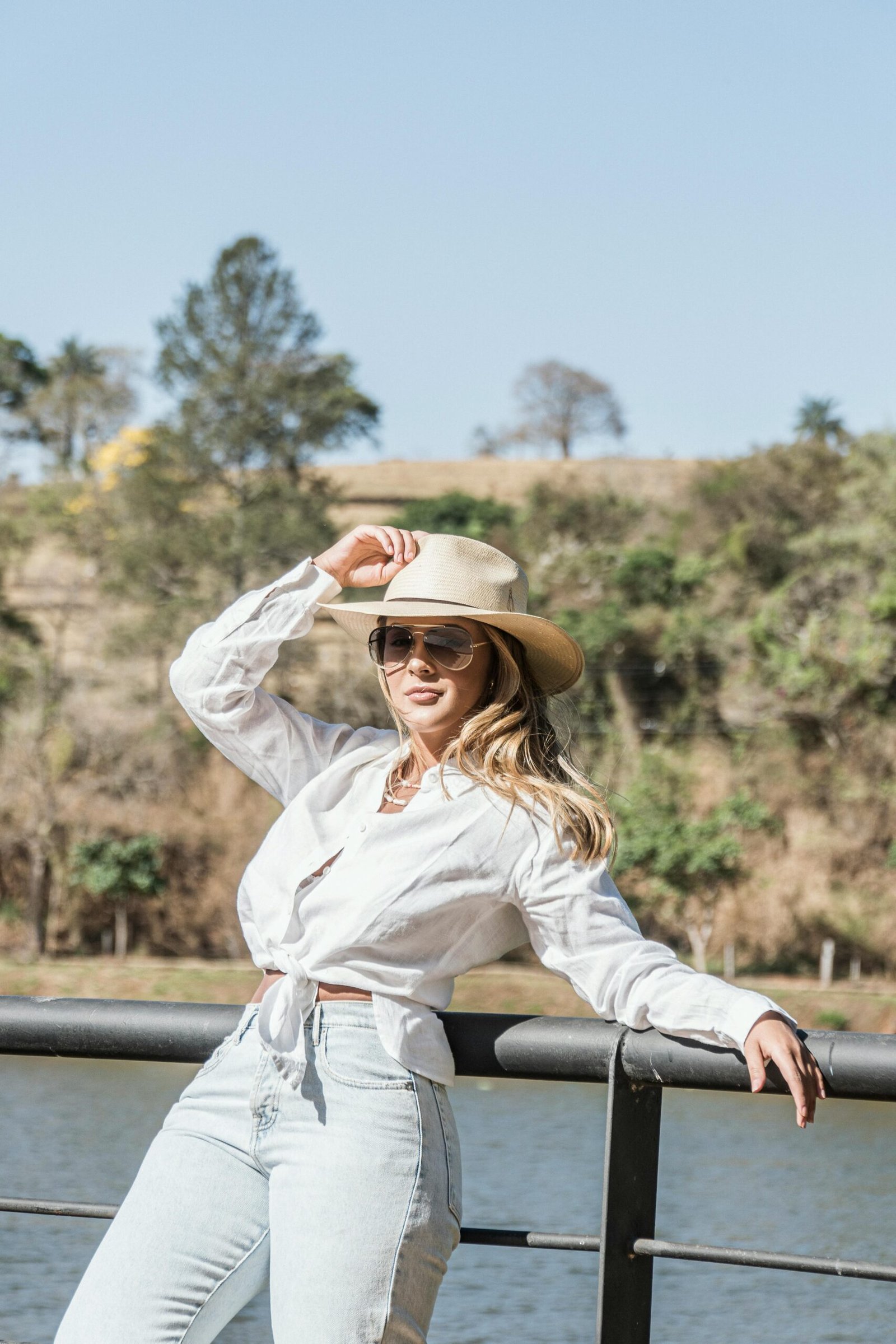 Chic woman in white blouse and hat